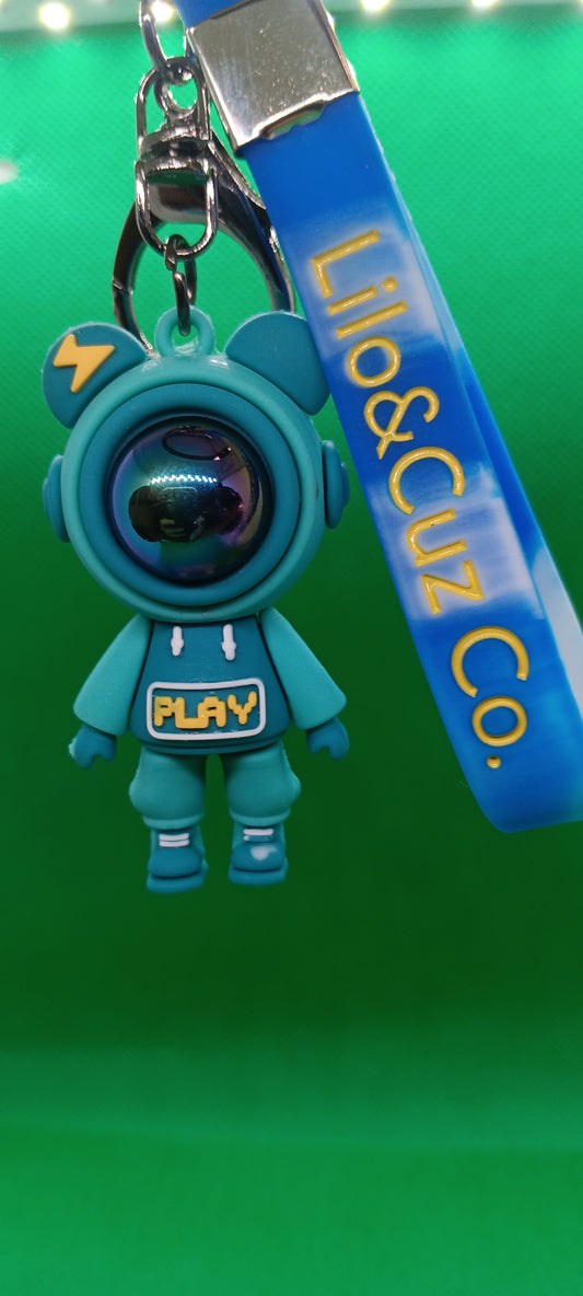 Teal astronaut keychain